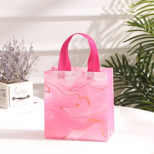 Modern pink marble pattern non-woven gift bag with golden lines and sturdy handles
