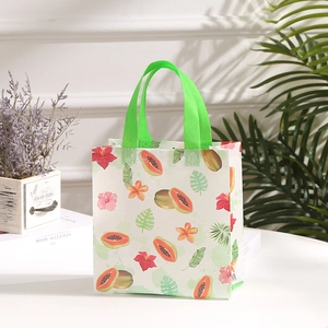 Waterproof non-woven shopping bag featuring tropical papaya and floral print patterns