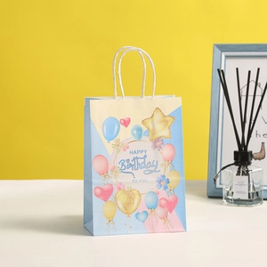 Colorful Happy Birthday paper gift bag with balloons and sturdy white rope handles