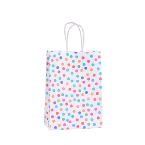 White kraft paper gift bag with colorful star dots and white twisted rope handles