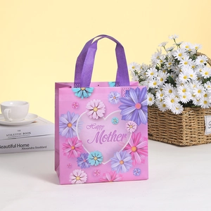 Pink non-woven gift bag with purple daisy heart pattern for Happy Mother's Day