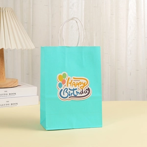 Mint green Happy Birthday kraft paper gift bag with balloons and white rope handles