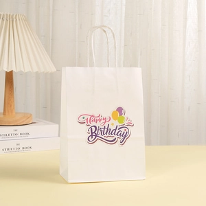 White Happy Birthday gift bag with colorful balloons and matching white twisted rope handles