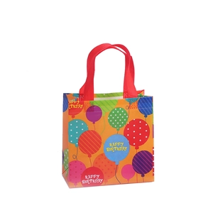 Colorful Happy Birthday gift bag with festive balloon print and red handles