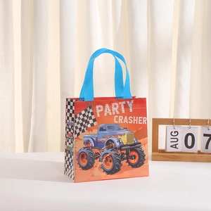 Orange Monster Truck non-woven gift bag with blue handles and party crasher racing print