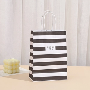 Striped kraft paper gift bag with Thank You print and white rope handles for shopping