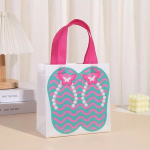 Close-up of non-woven waterproof gift bag with flip-flop pattern and pink handles