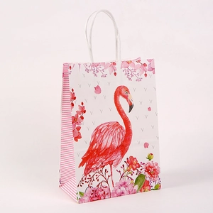 Close-up of premium kraft paper gift bag with floral patterns and pink flamingo design