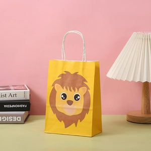 Close-up of a yellow kraft paper gift bag with a cute lion print and white cord handles