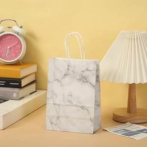 Elegant white marble pattern paper gift bag with braided handles for party favors