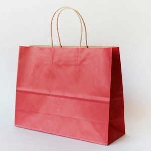 Eco-friendly red kraft paper gift bag with durable twisted rope handles and gusset