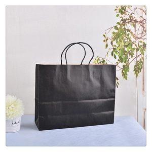 Matte black kraft paper gift bag with braided rope handles for premium shopping