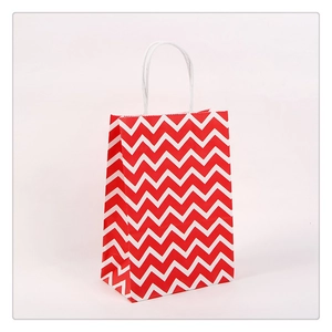 Durable kraft paper gift bag with red and white chevron pattern and white paper handles