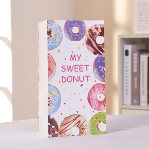 White paper gift bag with colorful donut prints and My Sweet Donut text for party favors