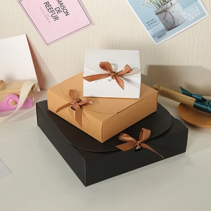 Three square gift boxes with brown satin ribbons and elegant bow ties in various sizes