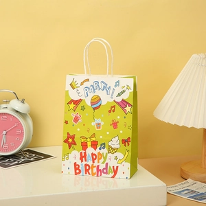 Detail of happy birthday kraft paper gift bag with balloons and white rope handle