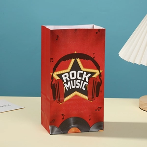 Red rock music gift bag with headphones design on a yellow table against blue wall
