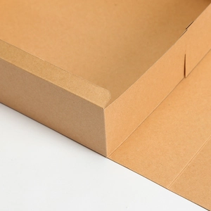 Detailed close-up of thick kraft paper gift box showing durable folded corner texture