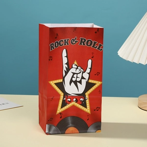 Detail showing rock and roll themed red kraft paper gift bag with musical note prints