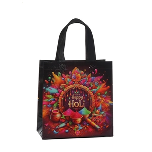 Colorful Happy Holi tote bag with vibrant printed patterns on premium black non-woven fabric