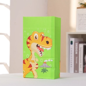 Sac cadeau vertical en papier vert avec motif dinosaure dessin animé et volcan