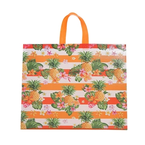 Tropical striped woven tote bag with pineapple and leaf patterns on white background