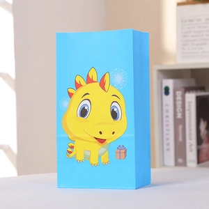 Sac cadeau bleu ciel avec dinosaure jaune pour fêtes et anniversaires enfants