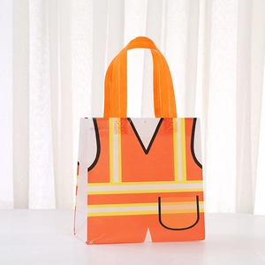 Detail of creative orange safety vest non-woven gift bag with reflective stripes