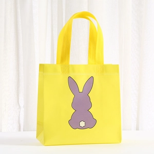 Yellow non-woven Easter gift bag featuring a purple cartoon bunny print with white tail