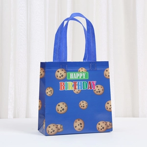 Blue Happy Birthday non-woven gift bag with chocolate cookie patterns and handles