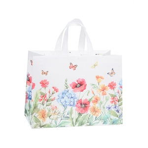 White non-woven gift bag with floral print and reinforced handles for shopping
