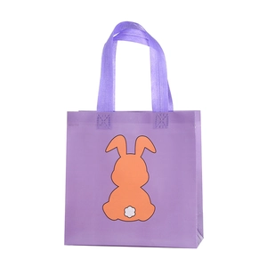 Purple non-woven Easter gift bag featuring a cute orange rabbit print and sturdy handles