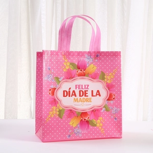 Pink Mother's Day non-woven gift bag with white dots and colorful tulip flower bouquet