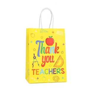 Sac cadeau jaune pour enseignants avec motifs de fournitures et texte de remerciement