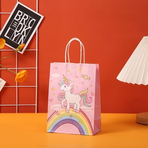 Pink kraft paper gift bag with cute cartoon unicorn and rainbow pattern for parties