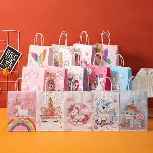 Detail of colorful unicorn and mermaid kraft paper gift bags with white twisted handles