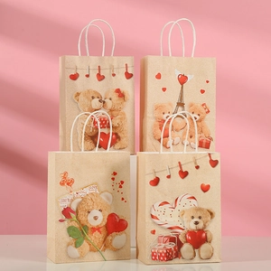 Kraft paper Valentine gift bags with romantic teddy bear prints and sturdy white handles