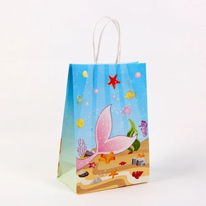 Detail of mermaid kraft paper gift bag with sea life print and white twist handles