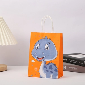 Detail of orange paper gift bag with blue dinosaur print and white rope handles