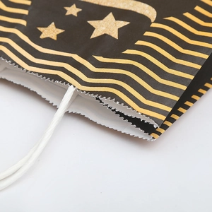 Cartoon birthday gift bag with golden wave and glitter star patterns and twisted handles