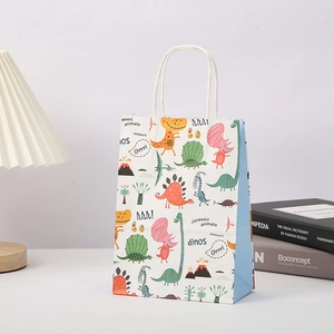 Detail view of cartoon dinosaur gift bag with white rope handles and artistic print