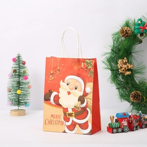 Detail of Christmas gift bag with Santa Claus cartoon and sturdy white cotton handles