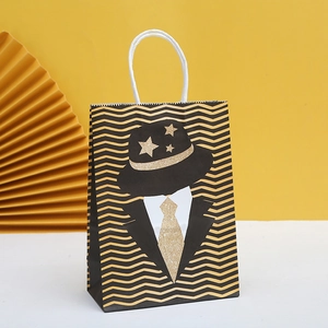Gentleman style gift bag with black and gold wave pattern and a bow tie graphic