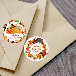 50mm Thanksgiving stickers with pumpkin and turkey designs on a brown envelope