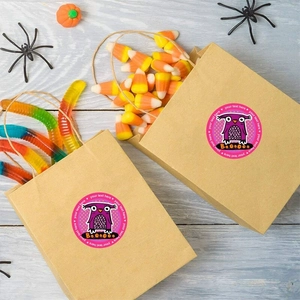 Custom purple owl Halloween sticker with Trick or Treat theme on kraft paper gift bag