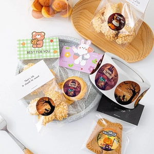 Halloween party labels and stickers set with pumpkin designs for candy gift packaging