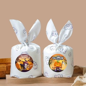 Halloween party favor bags with bunny ear design featuring witch and pumpkin themes