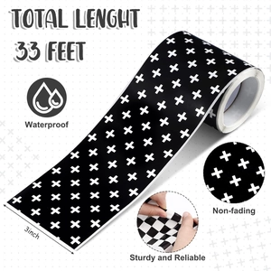 Macro shot of 3-inch black and white checkered waterproof border trim for bulletin boards