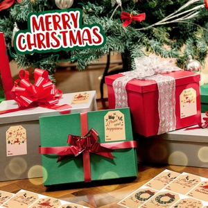 Close-up of Kraft paper Christmas gift tags with various hand-drawn festive designs