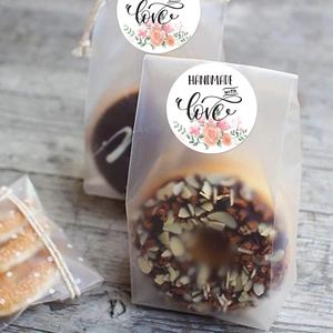 Detail of floral 'Handmade with Love' stickers on frosted food packaging bags